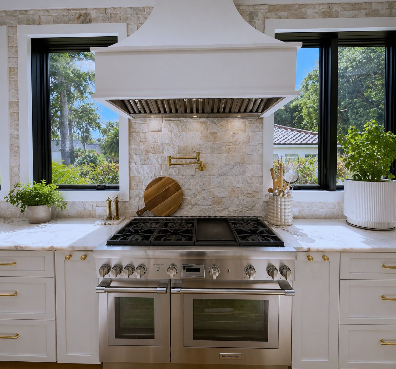 Double-oven gas range with pot filler and stone backsplash